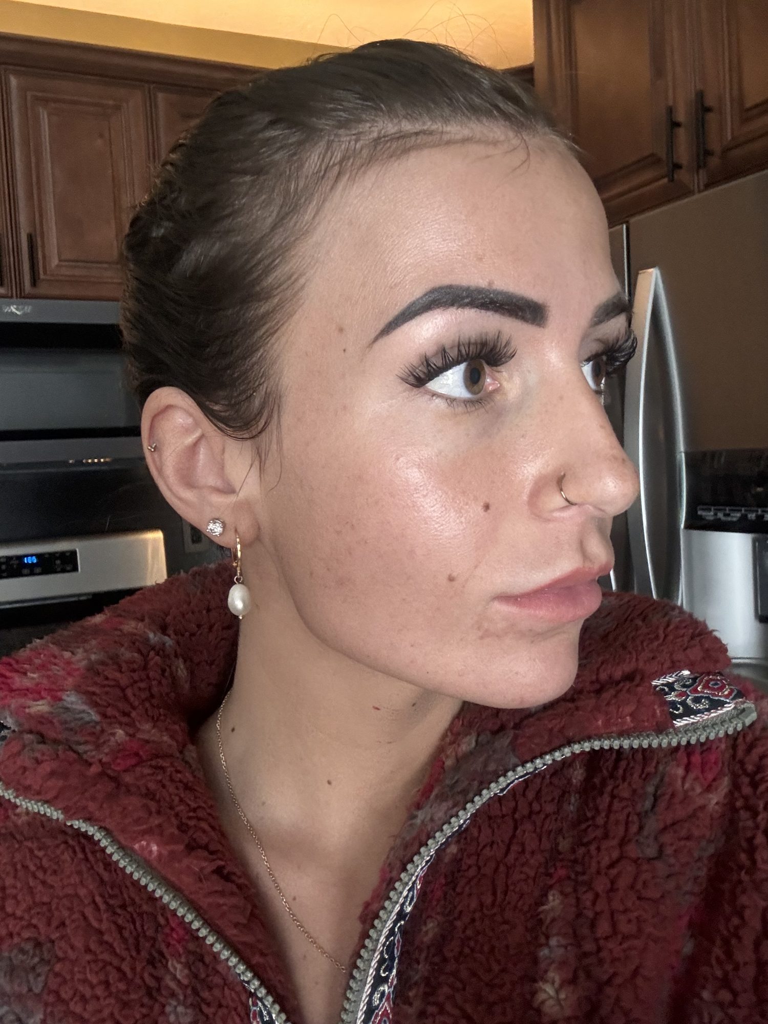 Esthetician using Dermaki skincare products